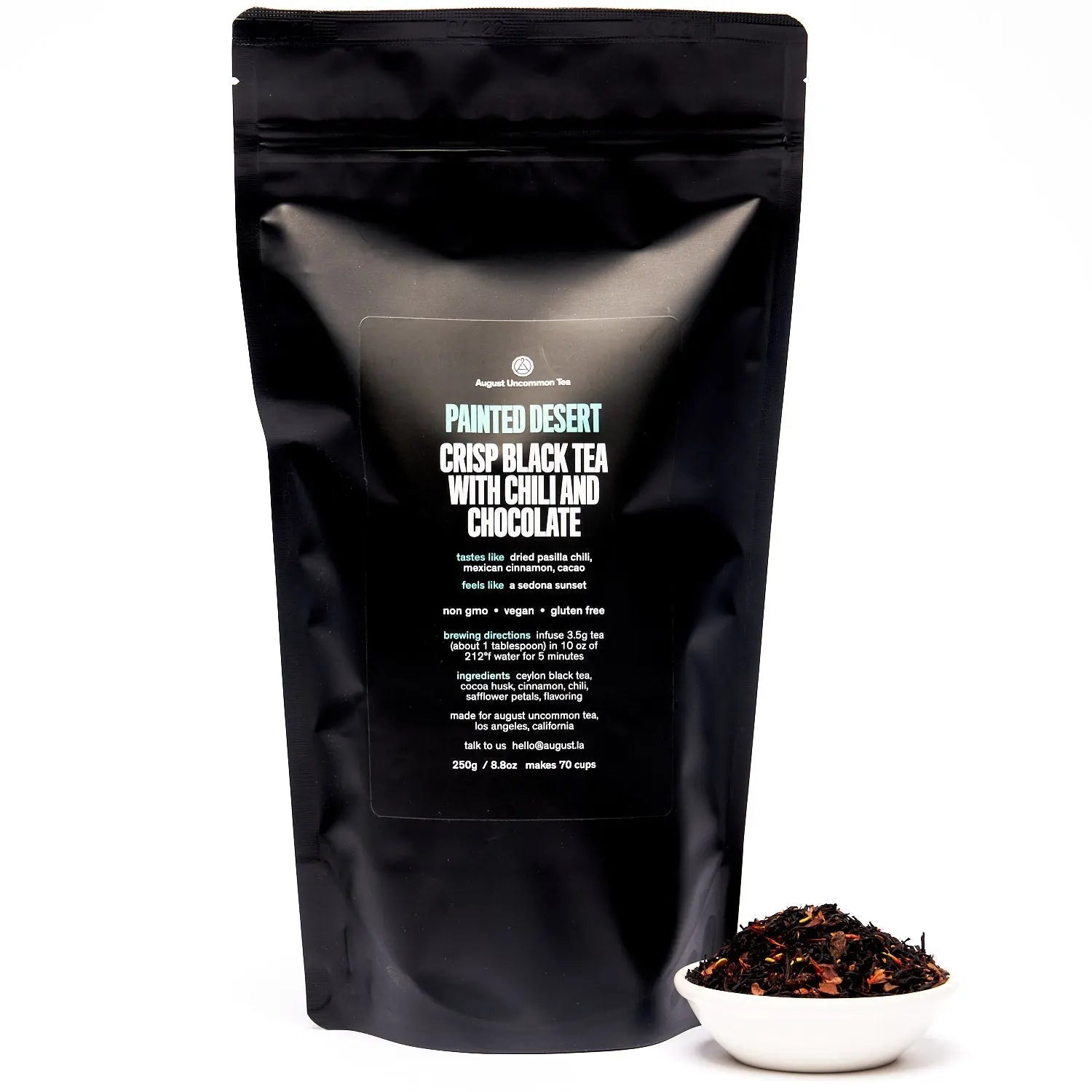 Cup of Painted Desert Chocolate Chili Black Tea with cinnamon and chili spices on wooden table