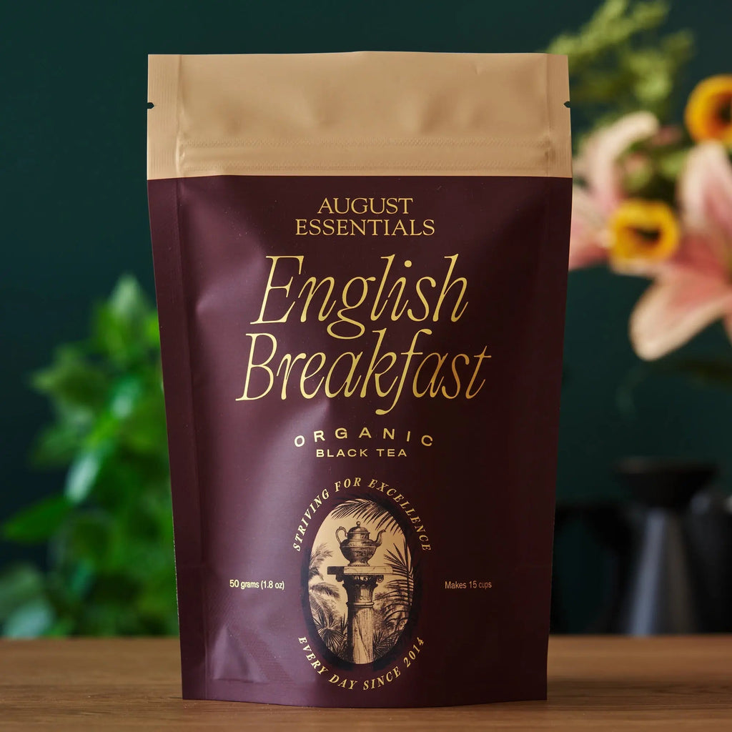 Essentials English Breakfast black tea packaging with organic South Indian tea bags and description of strong full-bodied flavor with bittersweet cocoa notes
