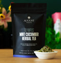 Olympus - Mint Cucumber Herbal Tea cup with fresh cucumber and peppermint leaves, caffeine-free herbal drink