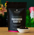 Southern Gothic Peach Bourbon Black Tea with caramel and peach flavors in a glass