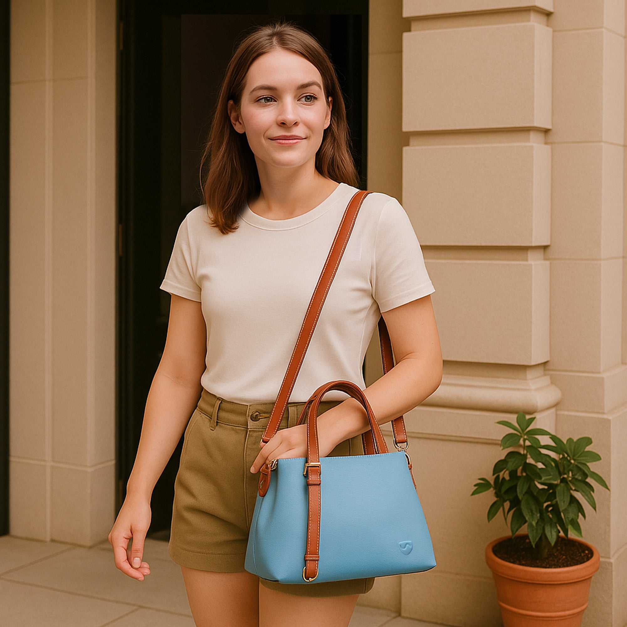 SYB Purse made with SaferBody™ shields up to 99% EMF radiation, features four compartments, removable shoulder strap, and durable vegan leather.