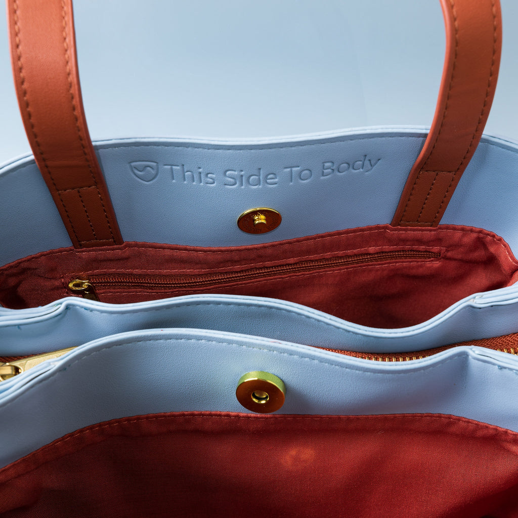 SYB Purse made with SaferBody™ shields EMF radiation, vegan leather, multiple compartments, carry handles and shoulder strap, fits any phone