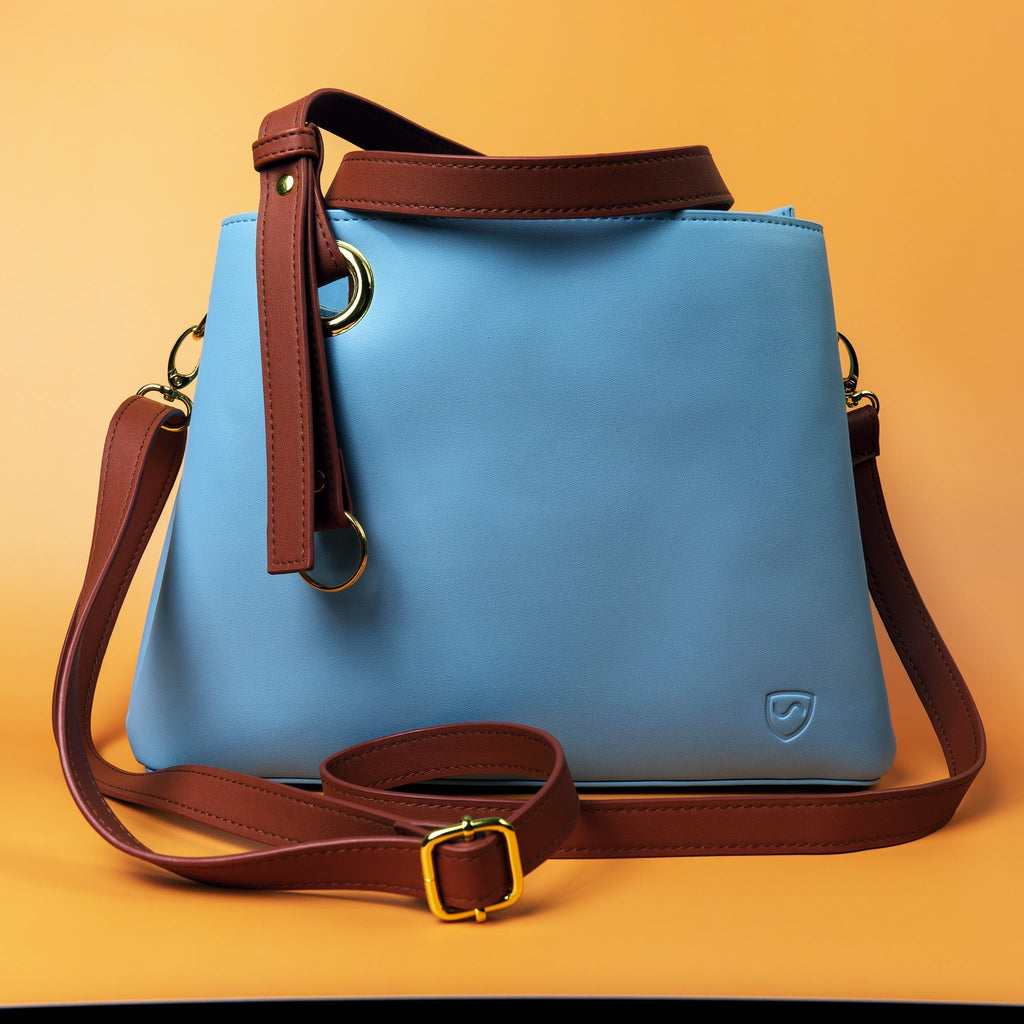SYB Purse made with SaferBody to shield 99% of EMF radiation, features four compartments, vegan leather, and two carrying options.