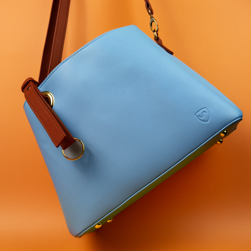 SYB Purse made with SaferBody™ shielding EMF radiation, featuring vegan leather, multiple compartments, and removable shoulder strap
