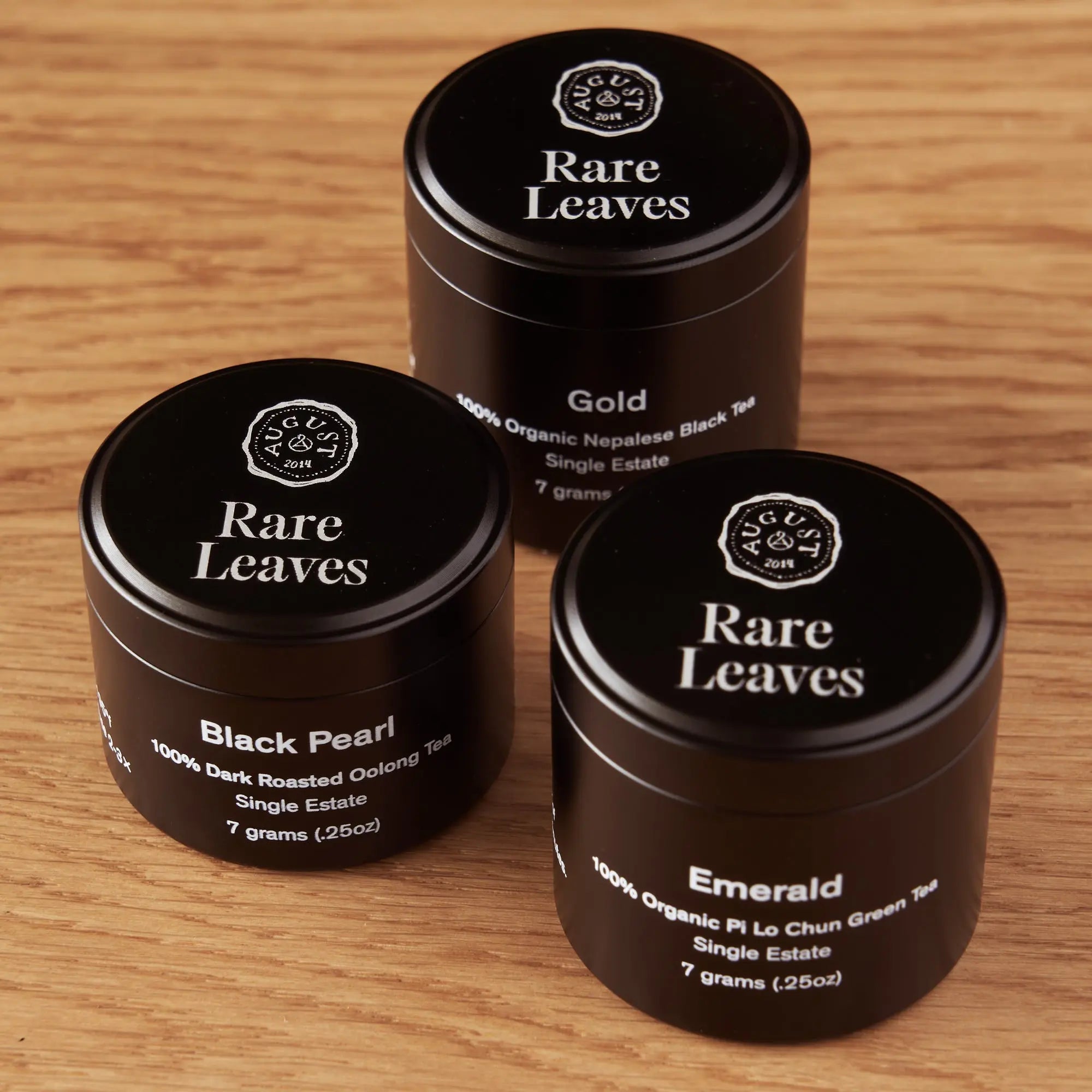 Rare Leaves Single Origin Tea Mini Tin Sampler with Emerald, Black Pearl, and Gold teas in airtight aluminum tins
